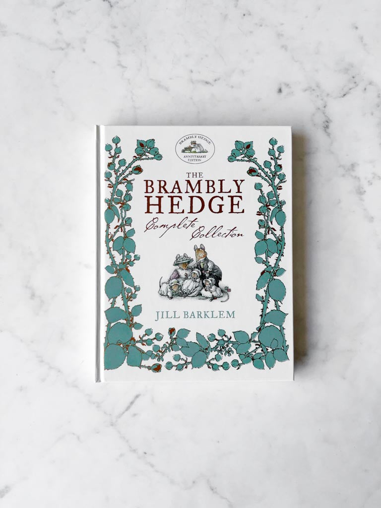 The Brambly Hedge Complete Collection book cover. Green leaves around the edges with a small piece of artwork in the middle.