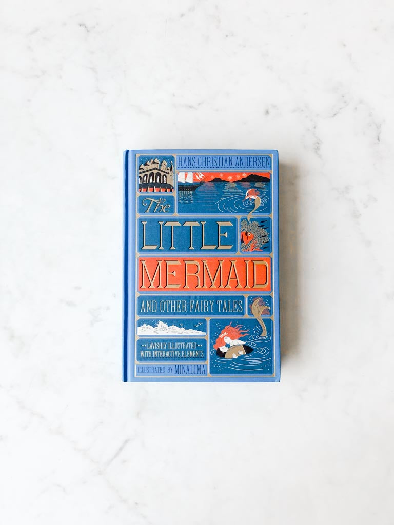 The cover of The Little Mermaid displaying a blue background with various are depictions of the ocean and characters with a large gold lettered title.