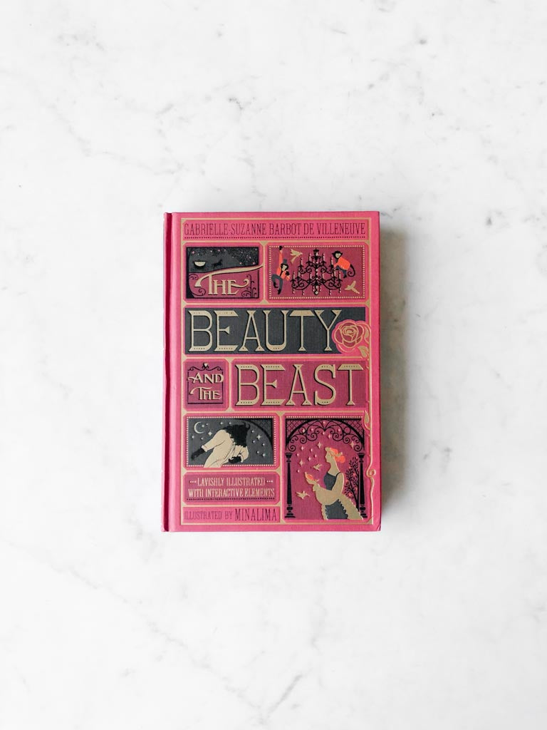 The red cover of the Beauty and the Beast book, displaying multiple characters and story settings, with the title in a large gold lettered font.