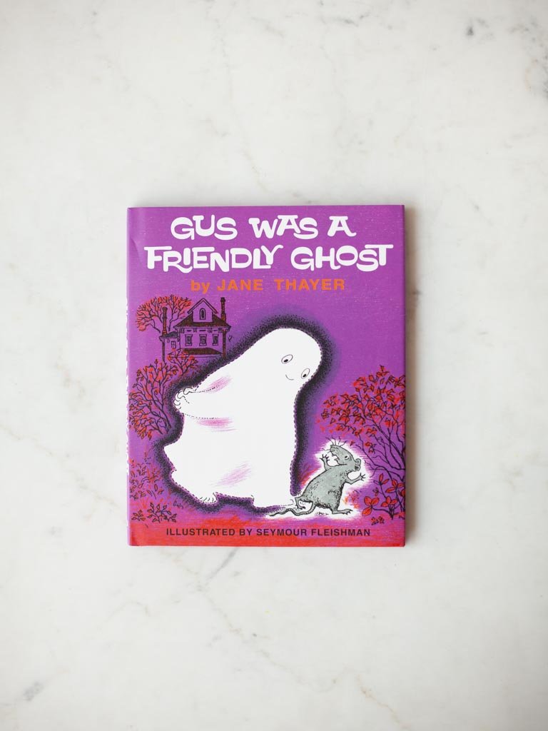 Gus the Friendly Ghost cover, Gus and a mouse walking alongside each other with a house in the distance.