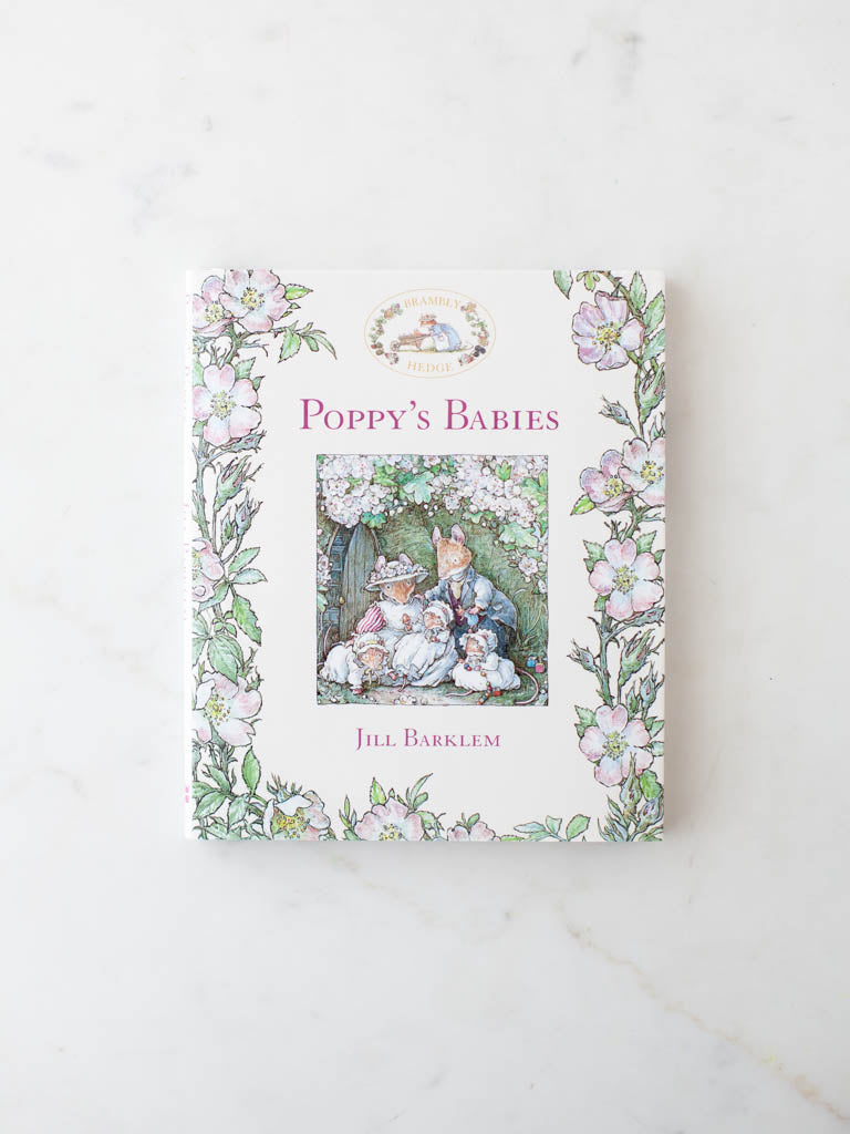 Poppy’s Babies book cover with pink flower leafy branches and character art in the middle.