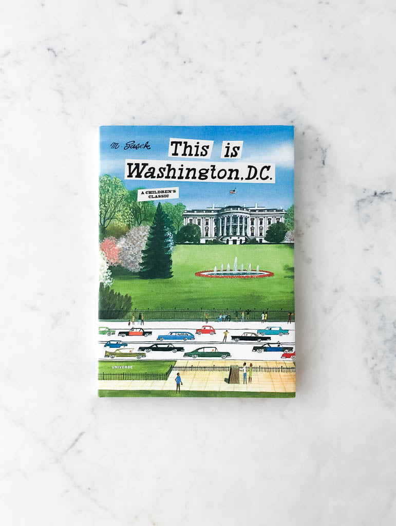 Colorful family friendly book cover labeled "This is Washington D.C.". Image on cover shows a view from the road in front of the White House.