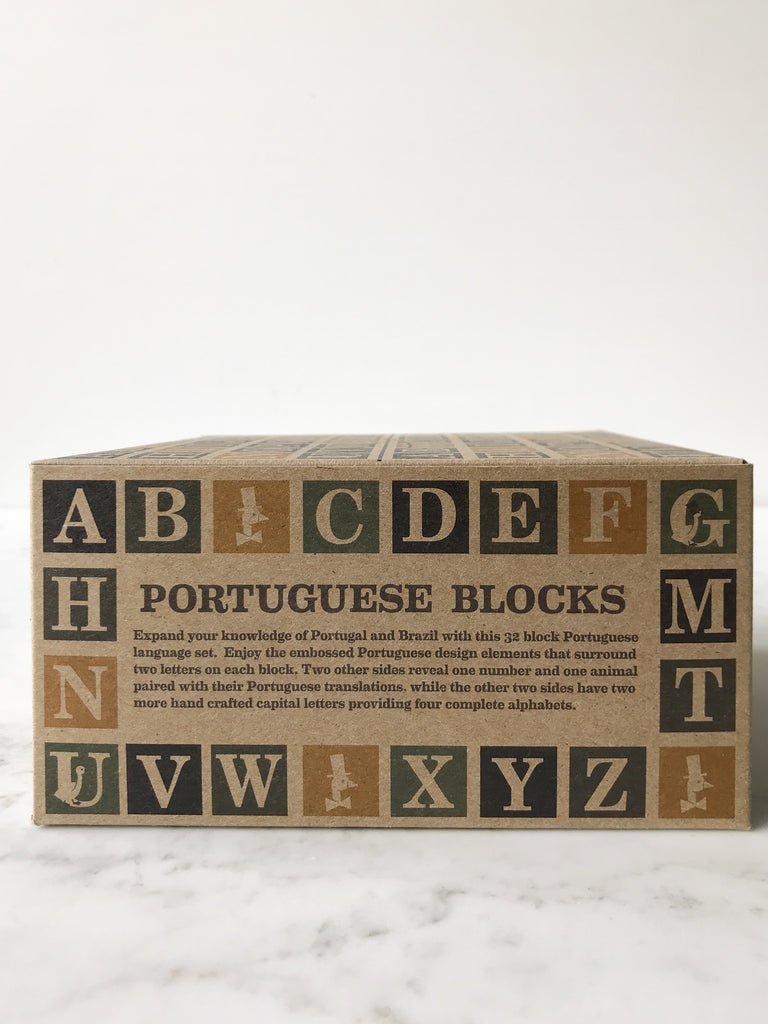 A box titled “Portuguese Blocks” with the abc’s wrapped around the sides of the box. 