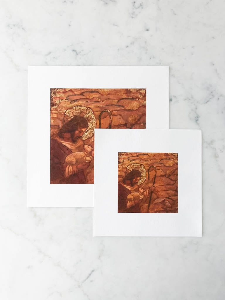 A print of a painting depicting a Jesus Christ holding a small sheep among a whole herd of sheep.