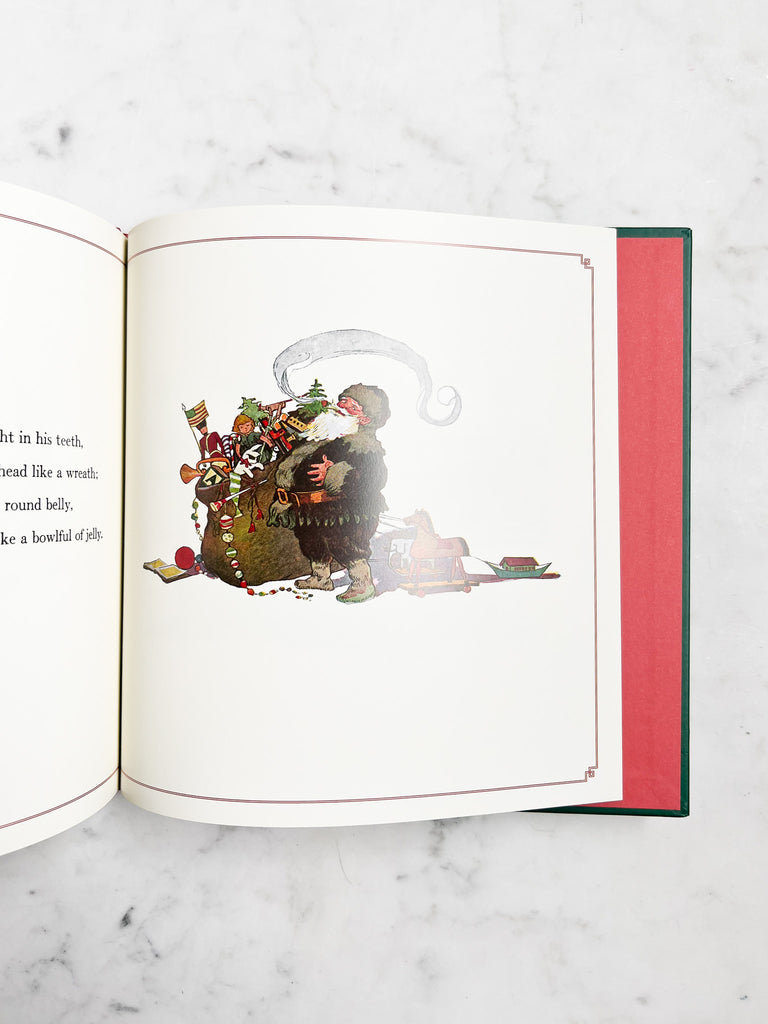 Sample page of book, showing Santa with a toy sack.