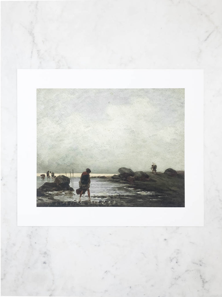 Close view of one unframed print. A shaded figure walks along a cloudy beach in the print.