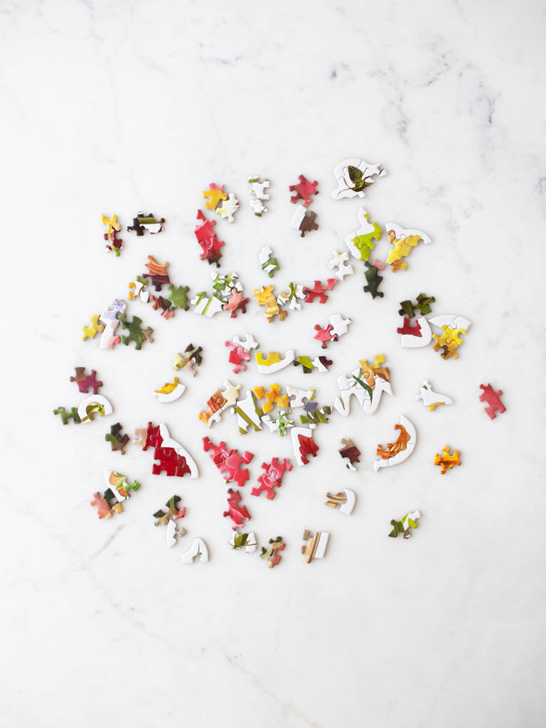 Scattered puzzle pieces. 
