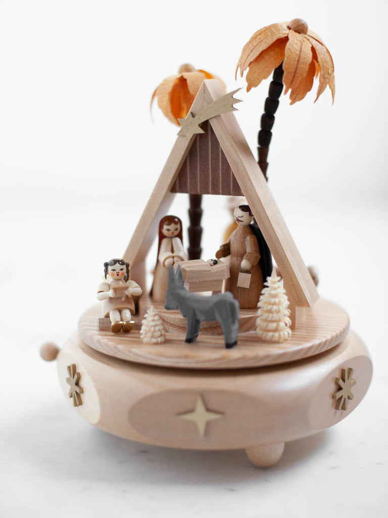 Wood sculpture music box from Germany, displaying a nativity scene.